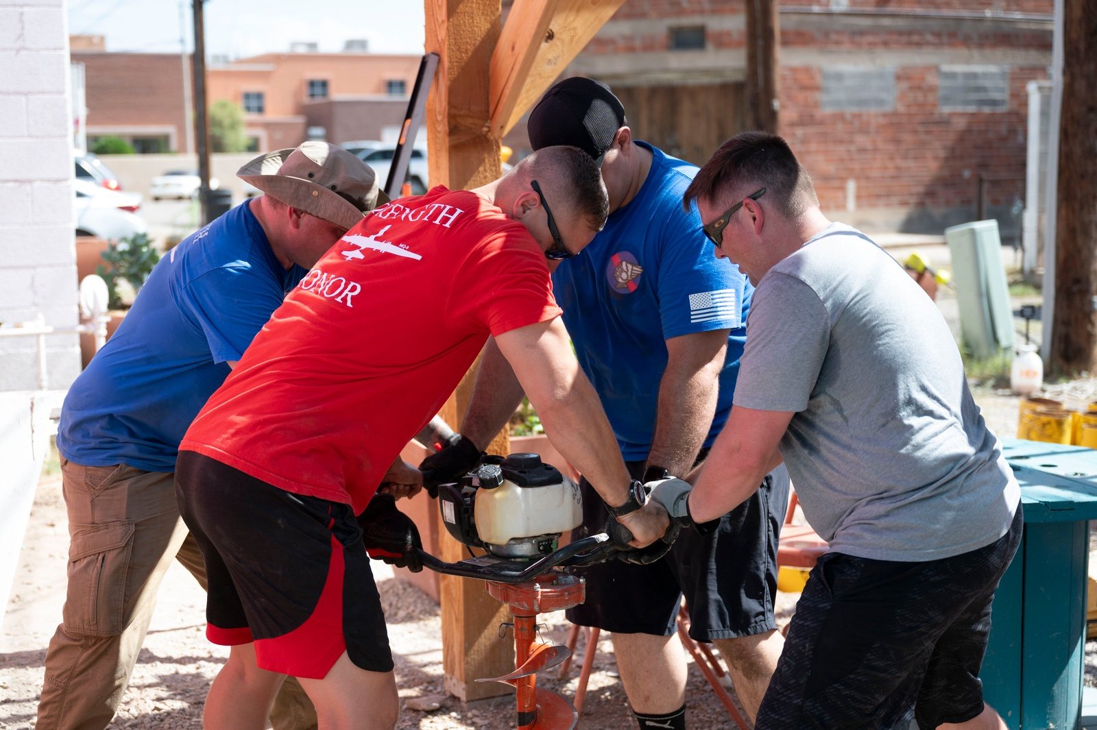 Volunteers working together on a community project in downtown Alamogordo, New Mexico.