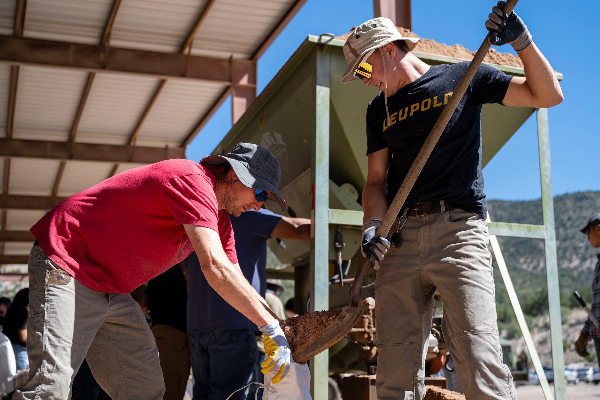 Volunteers fill sandbags after flooding affected the Mescalero Apache community.