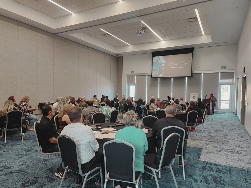 Participants gathered at tables for a community workshop.